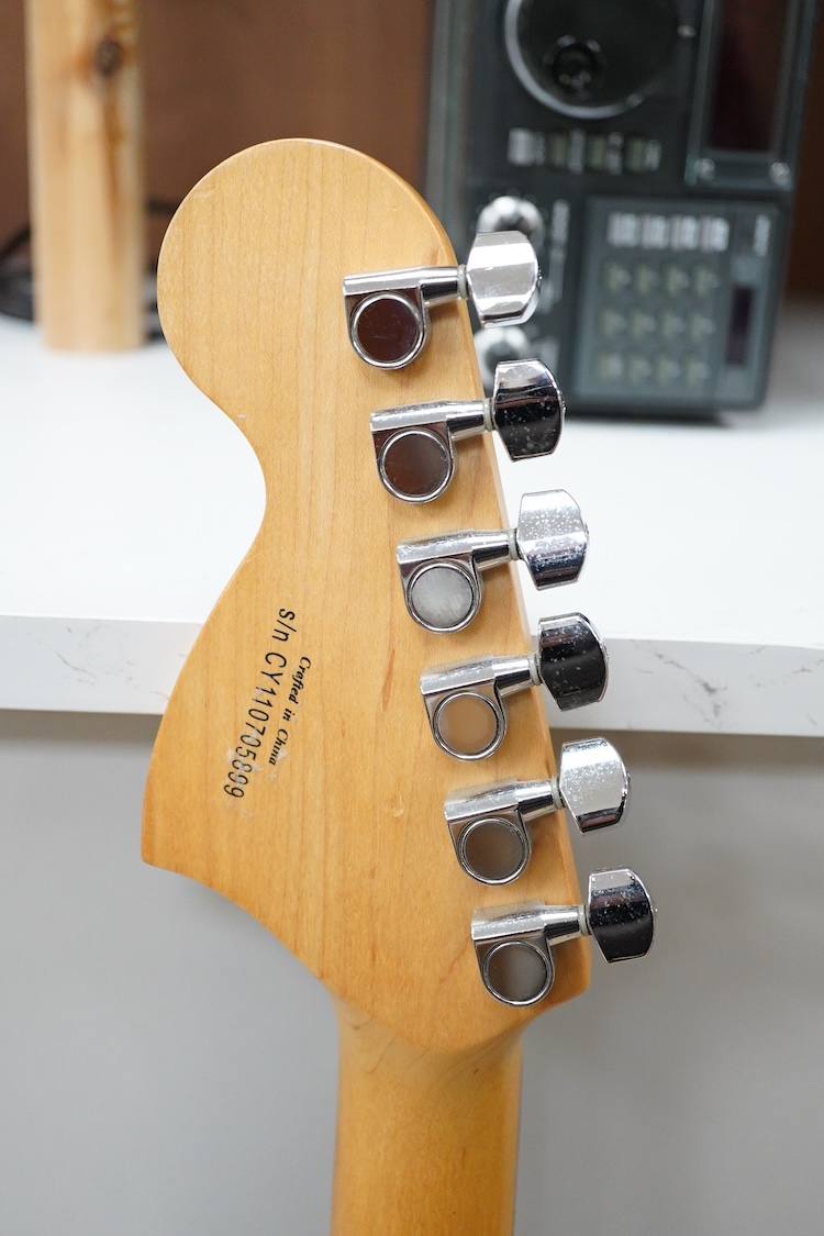 A Fender Squire electric guitar, with a Kinsman soft case, together with a Peavey VYPYR 15W modelling amplifier